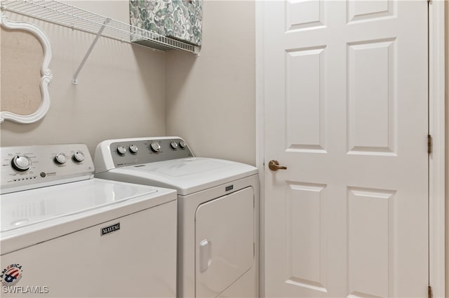 clothes washing area featuring washing machine and clothes dryer