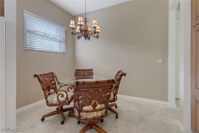 tiled dining area with a notable chandelier