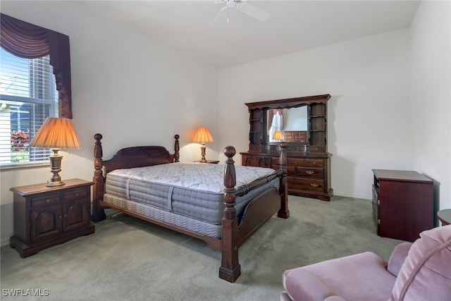 bedroom with light carpet and ceiling fan