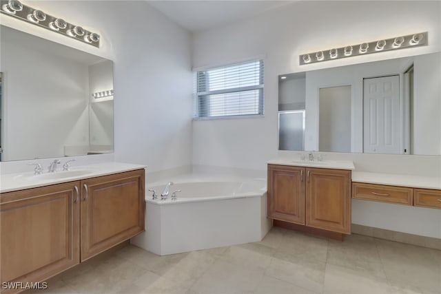 bathroom with vanity, tile patterned floors, and independent shower and bath