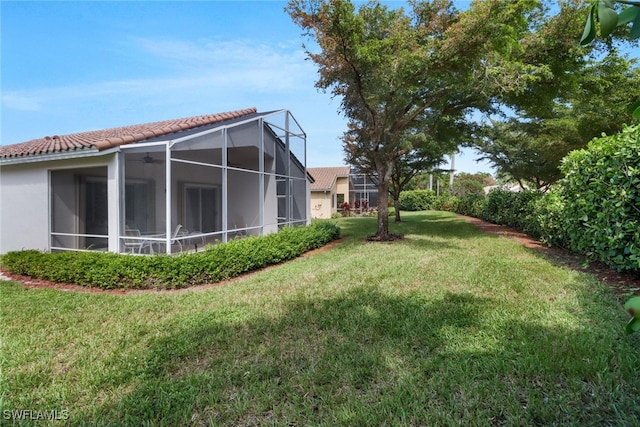 view of yard with a lanai