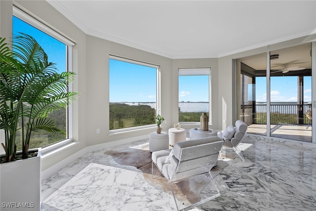 sunroom / solarium featuring a water view and a healthy amount of sunlight