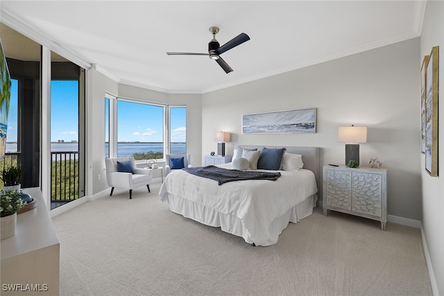 carpeted bedroom featuring ornamental molding, access to exterior, a water view, and ceiling fan