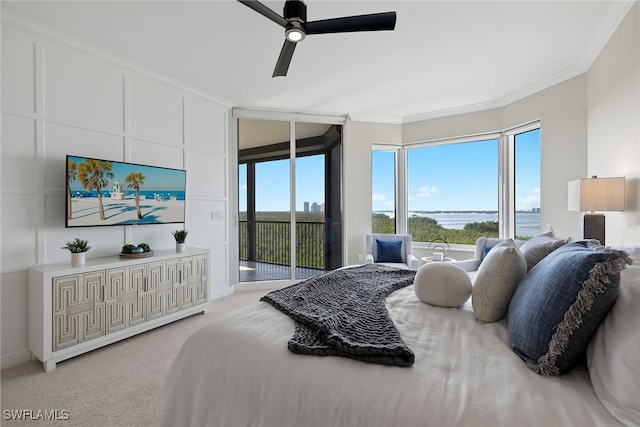 carpeted bedroom featuring crown molding, access to outside, and ceiling fan