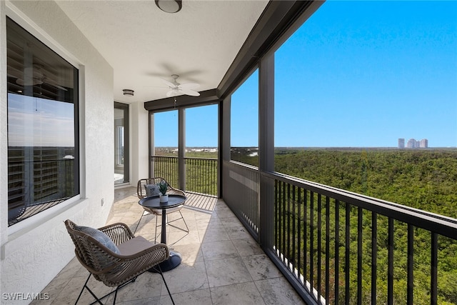 balcony featuring ceiling fan