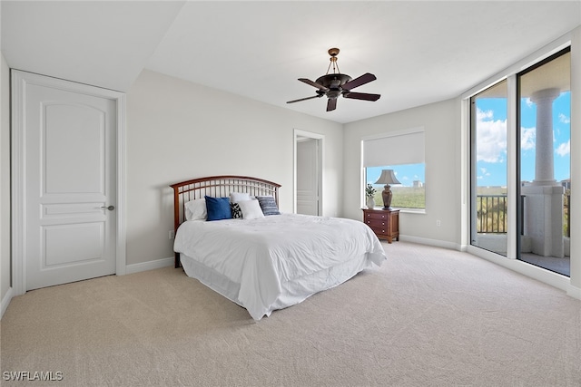 carpeted bedroom featuring ceiling fan and access to outside