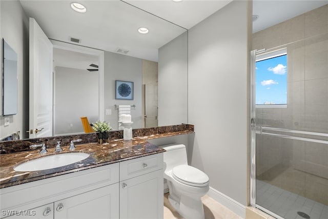 bathroom with vanity, toilet, and walk in shower