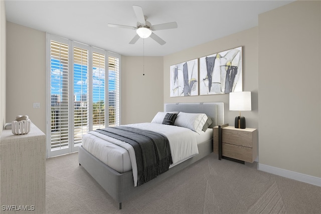 bedroom featuring light carpet and ceiling fan