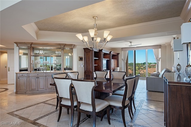 dining room featuring a textured ceiling, ceiling fan with notable chandelier, and ornamental molding