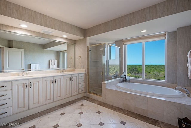 bathroom featuring vanity and separate shower and tub