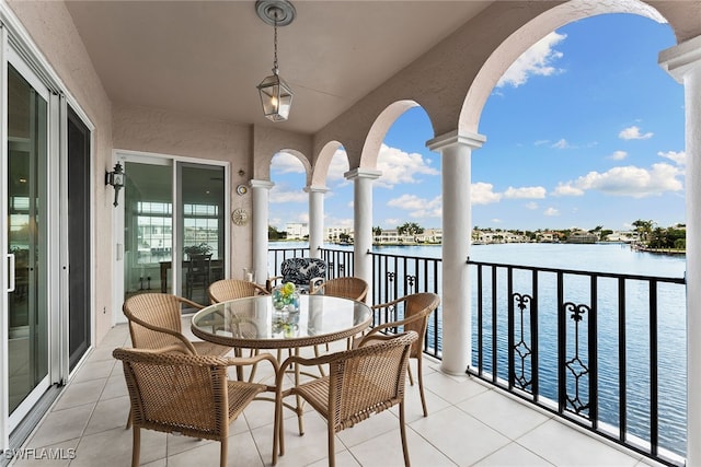 balcony featuring a water view