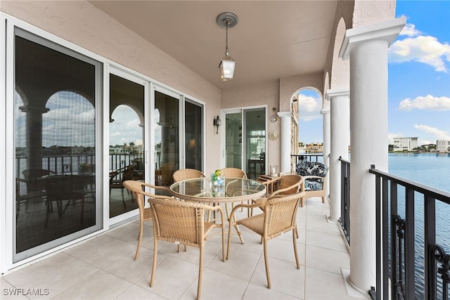 balcony featuring a water view