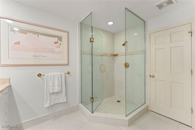 bathroom featuring vanity, tile patterned floors, and an enclosed shower