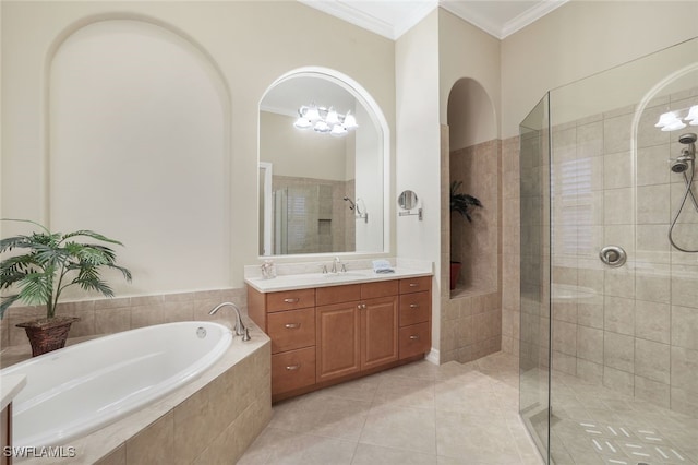 bathroom with independent shower and bath, vanity, and an inviting chandelier