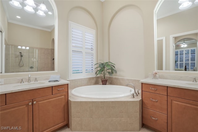 bathroom with crown molding, ceiling fan, vanity, and independent shower and bath