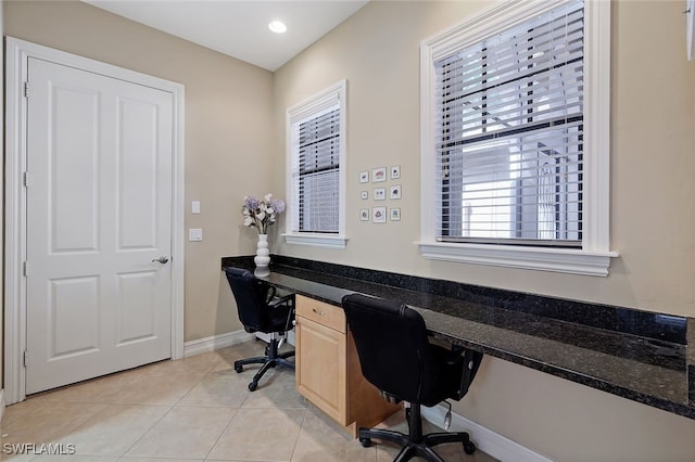 home office with light tile patterned floors