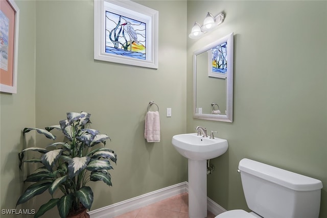 bathroom featuring tile patterned floors, sink, and toilet