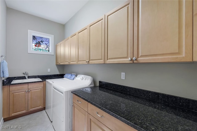 laundry room featuring washer and dryer, cabinets, sink, and light tile patterned floors