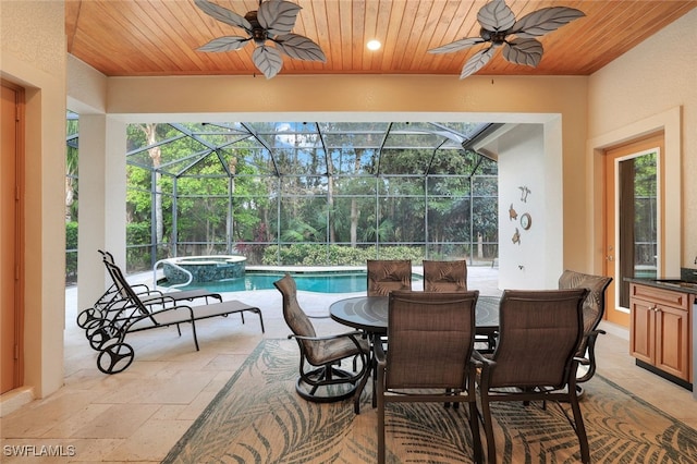 sunroom featuring ceiling fan, wood ceiling, and a swimming pool