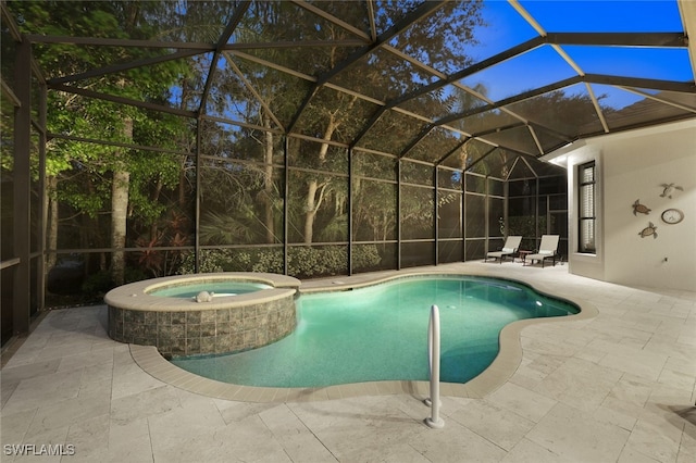 view of swimming pool with an in ground hot tub, a patio area, and a lanai