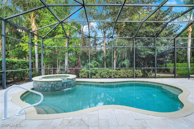 view of swimming pool featuring an in ground hot tub, a patio area, and a lanai