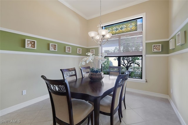 dining area with crown molding, an inviting chandelier, and light tile patterned floors