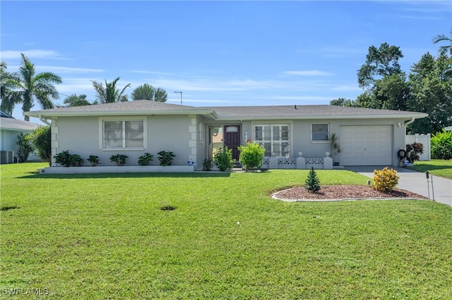 single story home with central air condition unit, a front lawn, and a garage