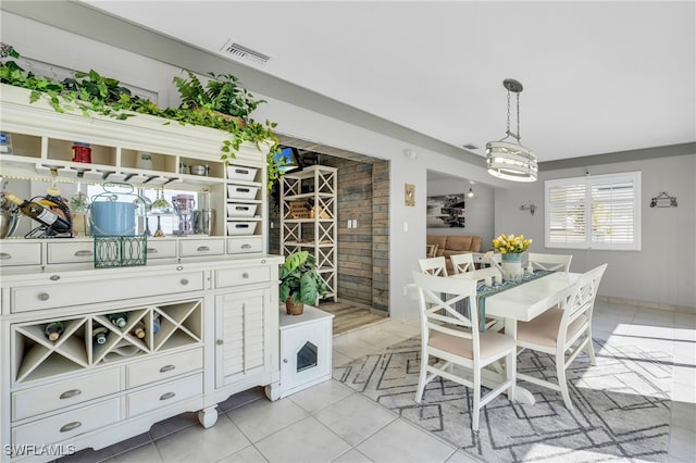 dining area featuring light tile patterned floors