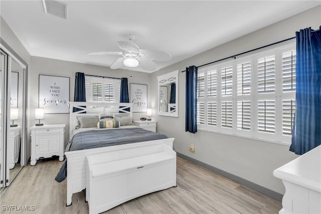 bedroom with ceiling fan and light wood-type flooring