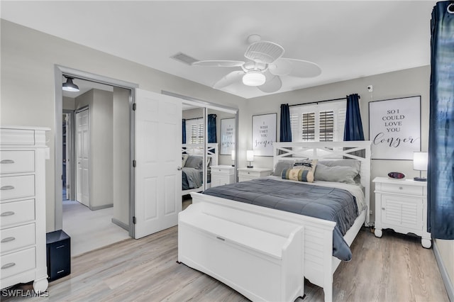 bedroom featuring light hardwood / wood-style floors and ceiling fan