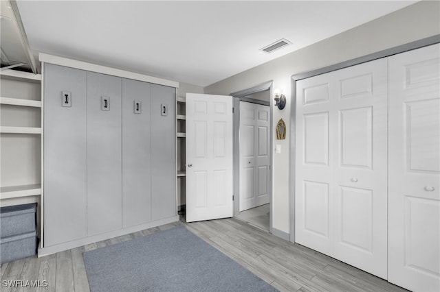 mudroom with light hardwood / wood-style flooring