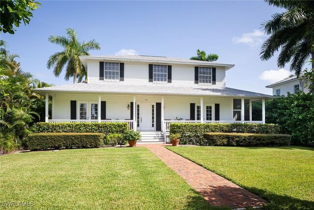 view of front facade featuring a front lawn and covered porch