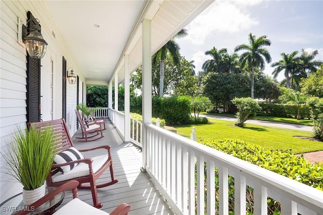 wooden terrace featuring a porch