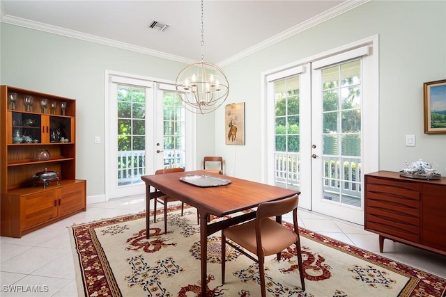 dining room featuring french doors, light tile patterned flooring, visible vents, and crown molding