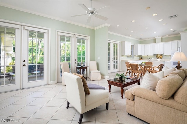 living area featuring recessed lighting, french doors, crown molding, and light tile patterned floors