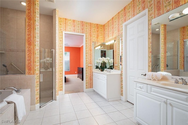 bathroom featuring wallpapered walls, a shower stall, baseboards, and a sink