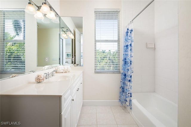 full bath featuring tile patterned flooring, shower / bathtub combination with curtain, vanity, and baseboards