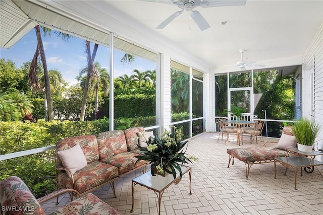 sunroom / solarium with ceiling fan and a wealth of natural light