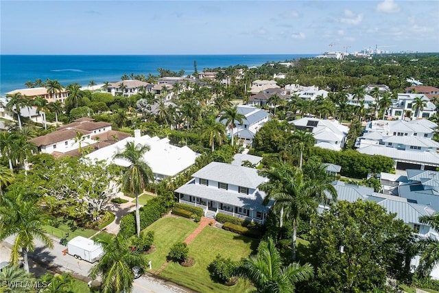 birds eye view of property featuring a water view and a residential view