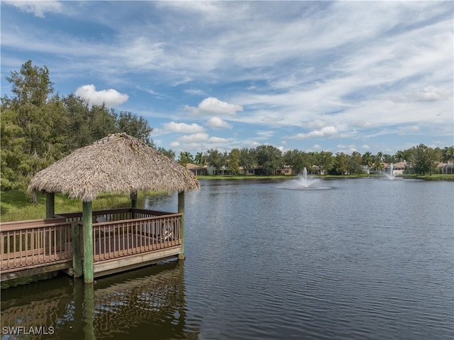 view of dock featuring a gazebo and a water view