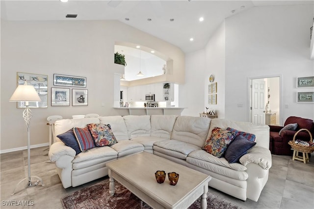 7539 Key Deer Ct, Fort Myers, FL 33966 - living room featuring light tile patterned floors, baseboards, high vaulted ceiling, and recessed lighting