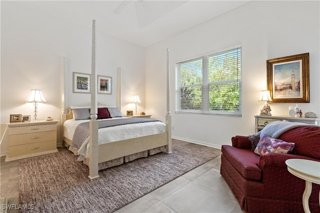 tiled bedroom with ceiling fan