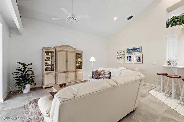 7539 Key Deer Ct, Fort Myers, FL 33966 - living area with baseboards, light tile patterned flooring, visible vents, ceiling fan, and high vaulted ceiling