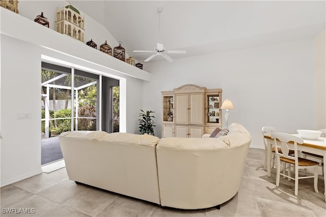 living room featuring high vaulted ceiling and ceiling fan