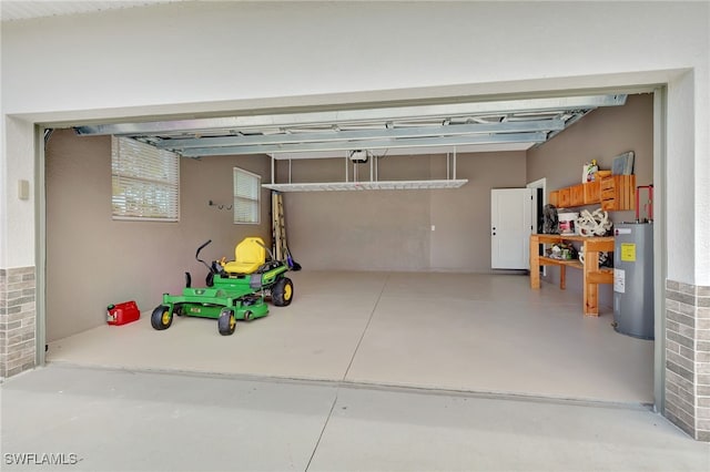 garage featuring electric water heater and a garage door opener