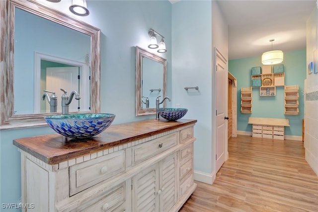 bathroom featuring vanity and hardwood / wood-style flooring