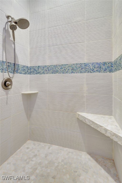 bathroom featuring tiled shower