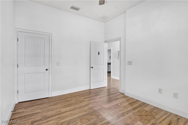 empty room with light hardwood / wood-style floors