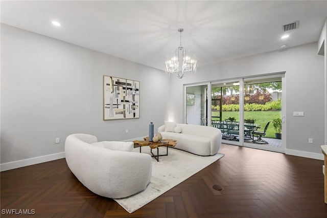 living room with a notable chandelier, recessed lighting, visible vents, and baseboards