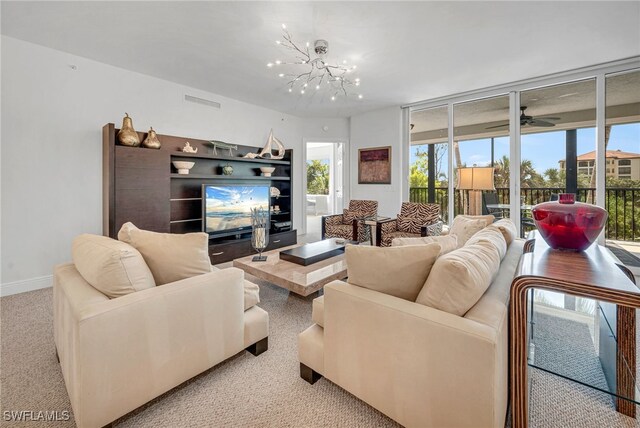 living area with a wall of windows, baseboards, and a chandelier